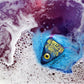 Southern Skye Beauty The Further Bath Bomb - planchette shaped bath bomb with a hand made soap eyeball dissolving in water