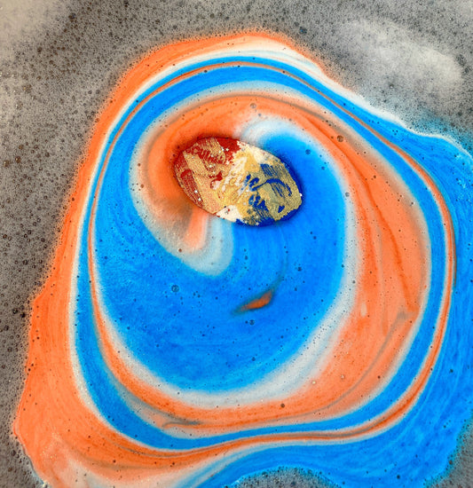 Southern Skye Beauty Bath Bomb - Red white and blue bath bomb scented in Fruit Punch dissolving in water